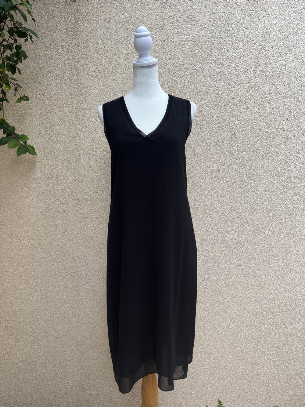 Vince black sleeveless V-neck shift dress with a layered hem detail